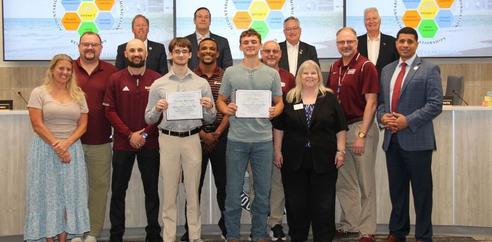 Baker State Champs pictured at SB Meeting with Family, SB members, and District officials.