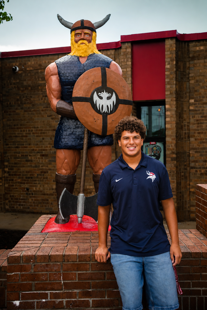 Micah Johnson in front of Viking FWBHS