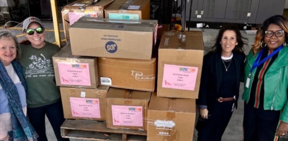 Blessing Bag Ministry, Okaloosa Public Schools Foundation, and Florida Blue Foundation representatives shown with 800 bags of essentials such as soap, shampoo, deodorant, and hairbrushes, being donated to students in Okaloosa County.