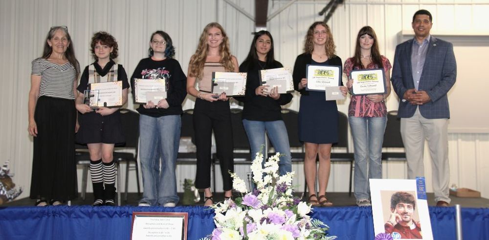 From L to R: Ms. Kim Moran (Fort Walton Beach High School Art Teacher, Hannah Leitheiser, Oliva McClain, Addie Kelly, Sofia Perez, Ellie Aldrich, Lucia Schrand, and Superintendent Marcus Chambers