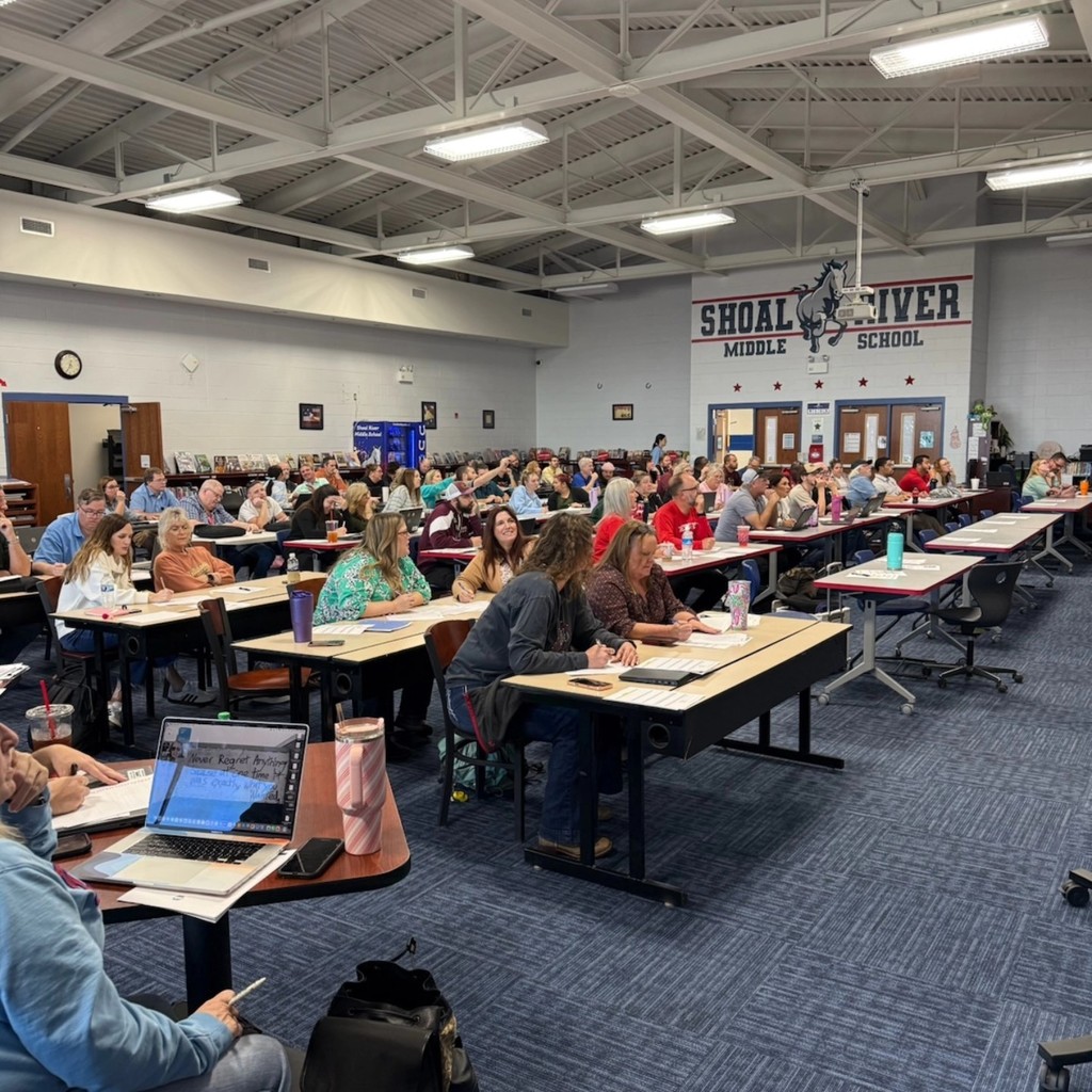 Teachers in auditorium during Professional Development day