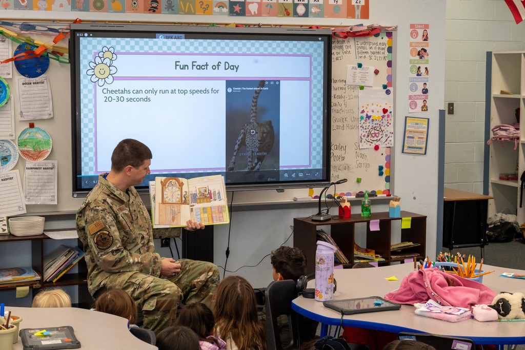 87th EWS Airman reading to class