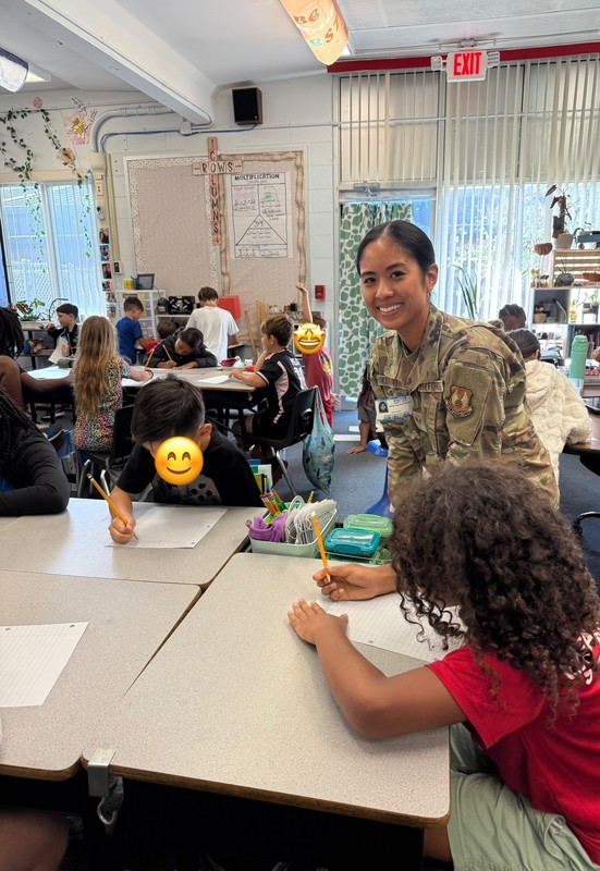 Members of the 96th Communications Squadron presenting a Cyber Security course to students