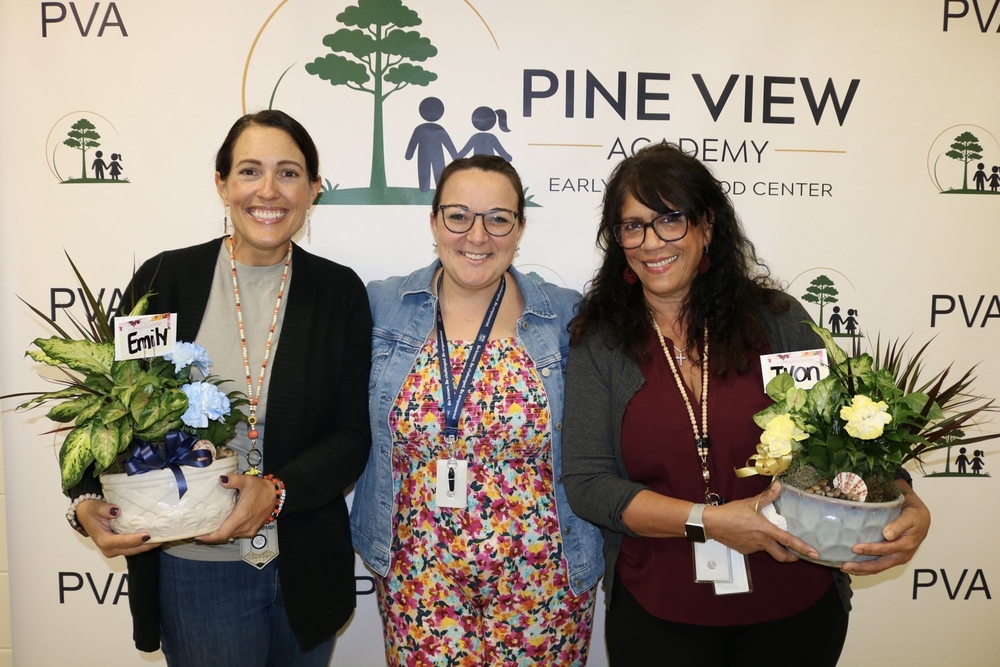 principal with two school staff members