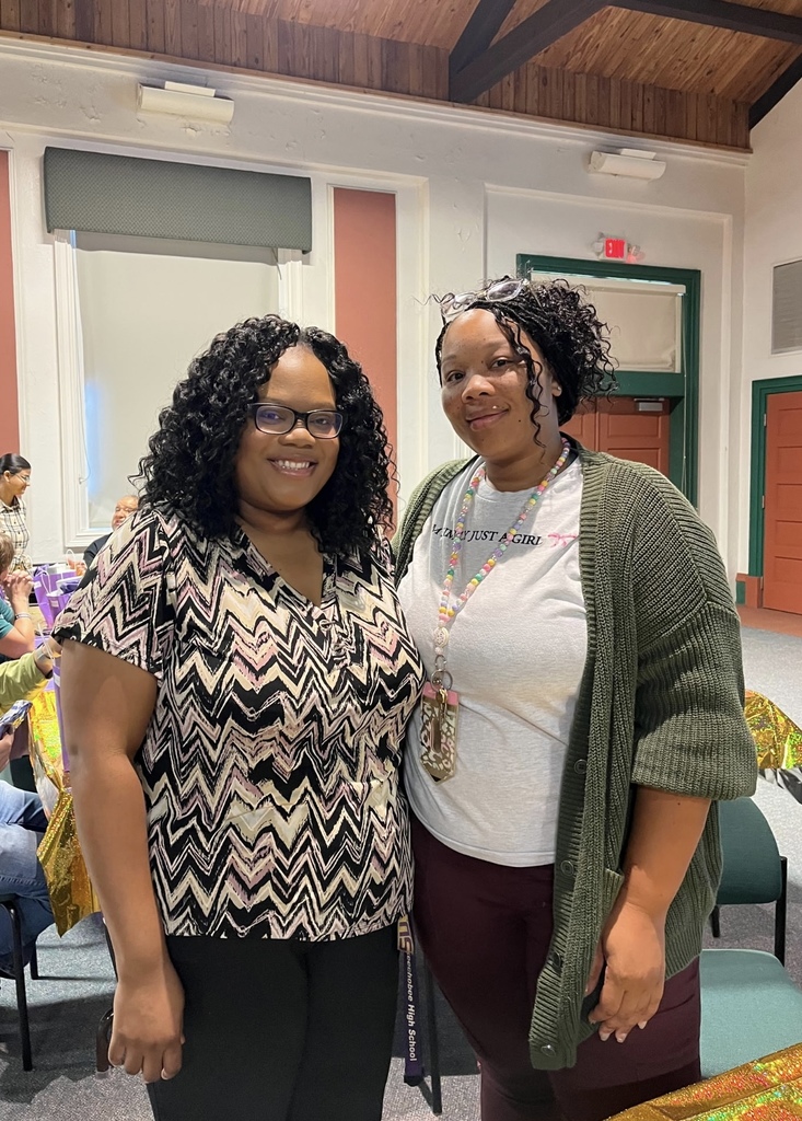 assistant principal and female teacher in auditorium