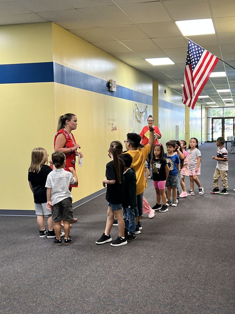 Mrs. Dobbins showing students around