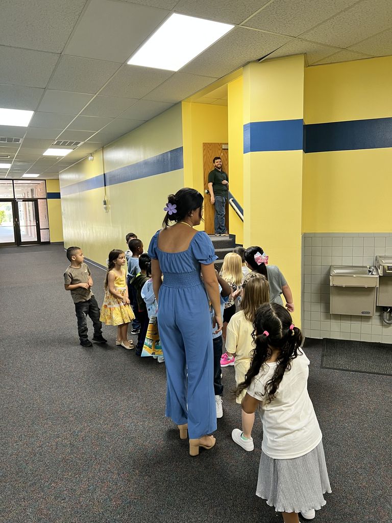 Ms. Zapata showing kindergarten Music