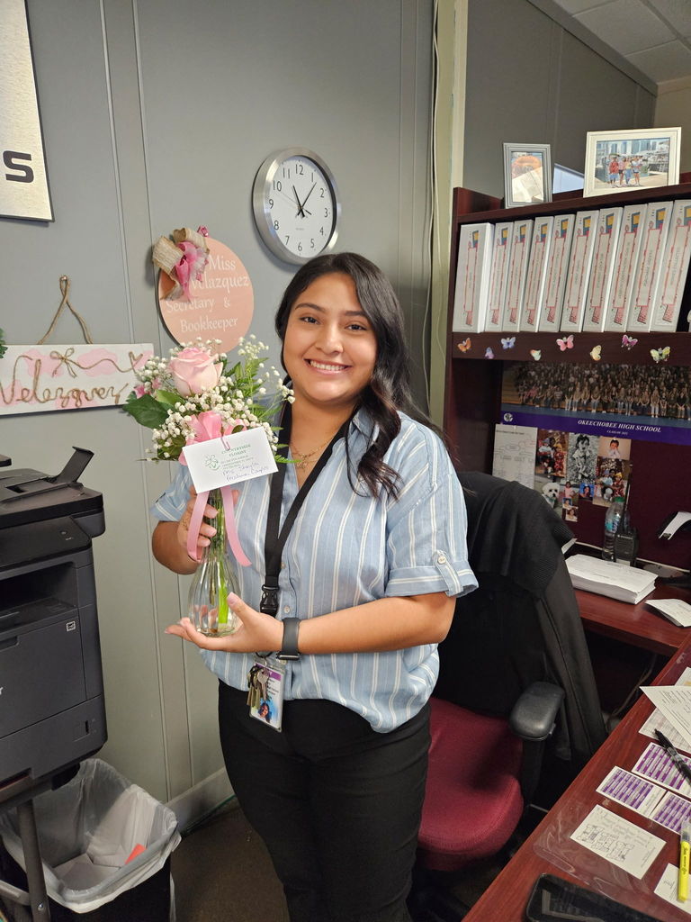 female school member with pink rose