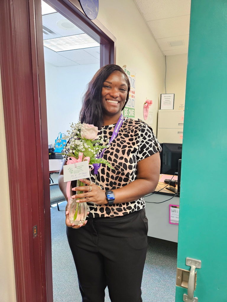 female school member with pink rose