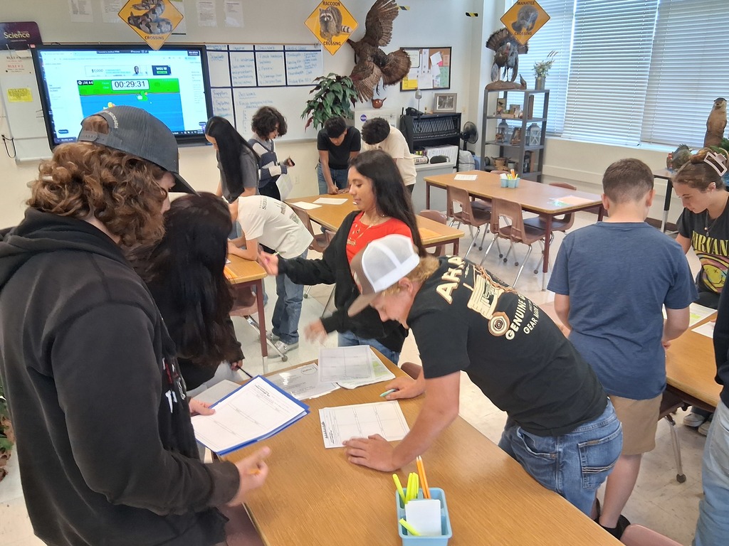 students working on scavenger hunt for science syllabus