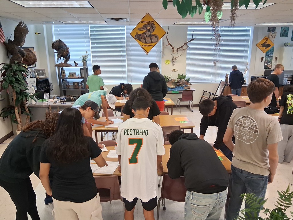 students working on scavenger hunt for science syllabus