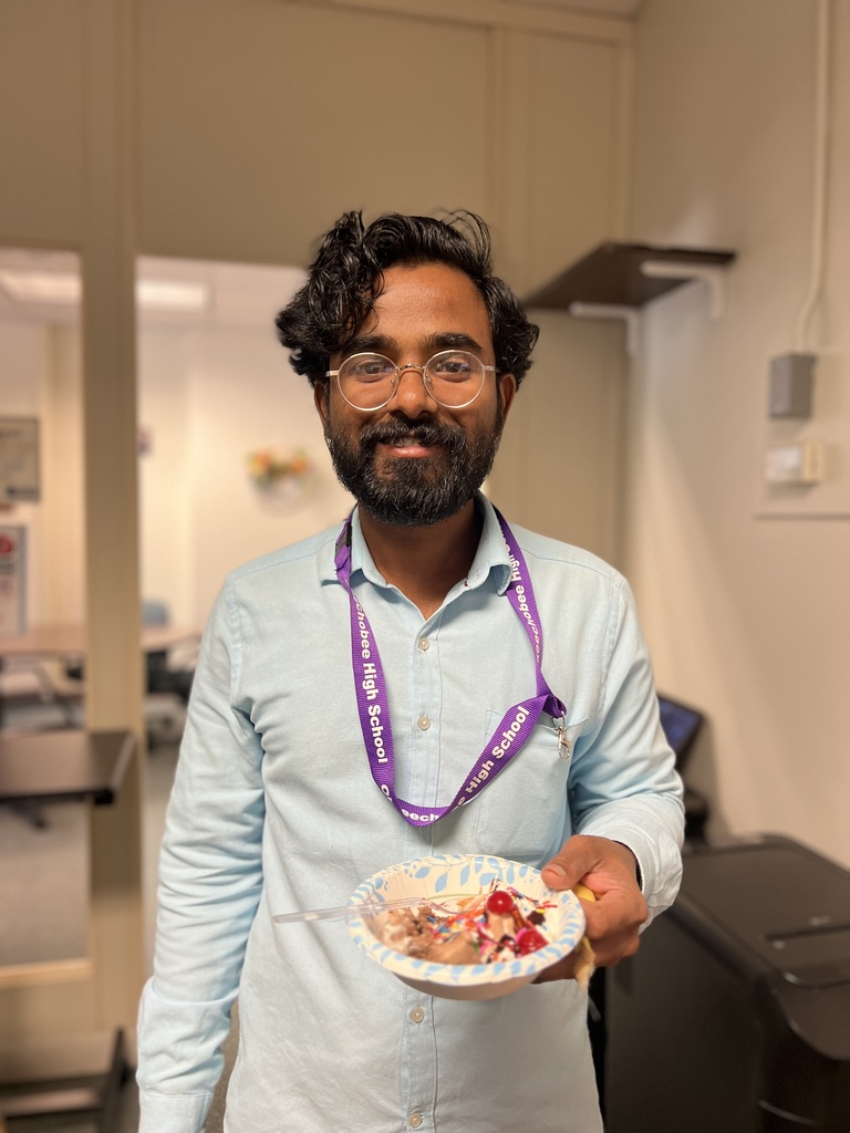 teacher showing his ice cream in main office