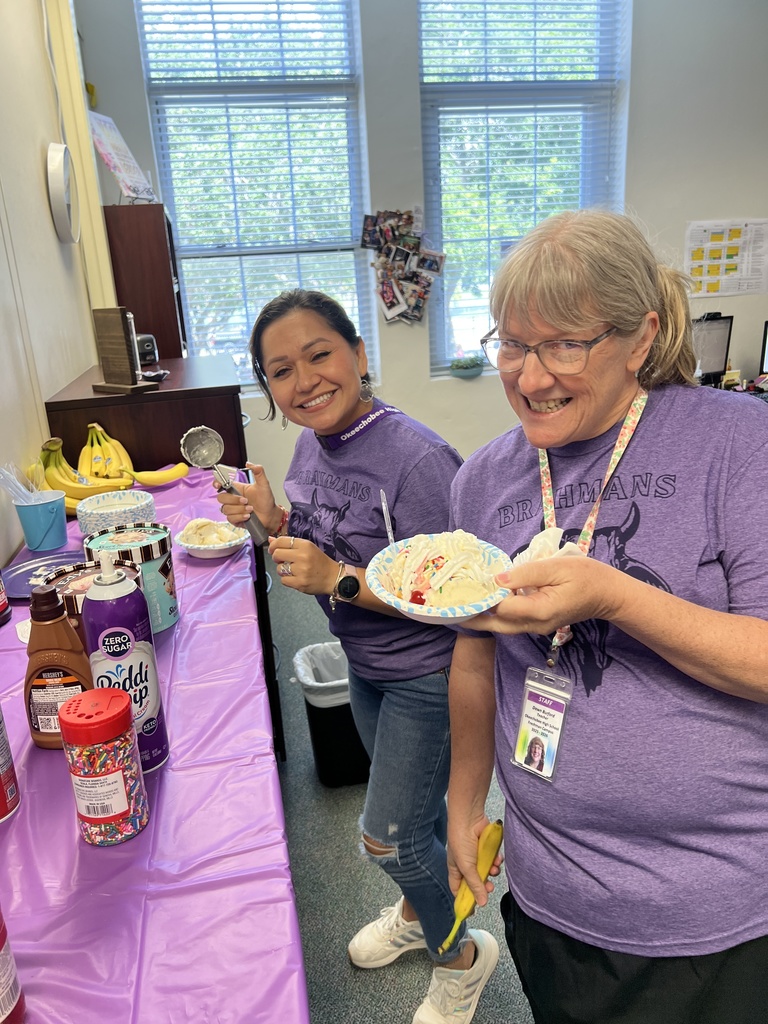two teachers serving themselves a banana split