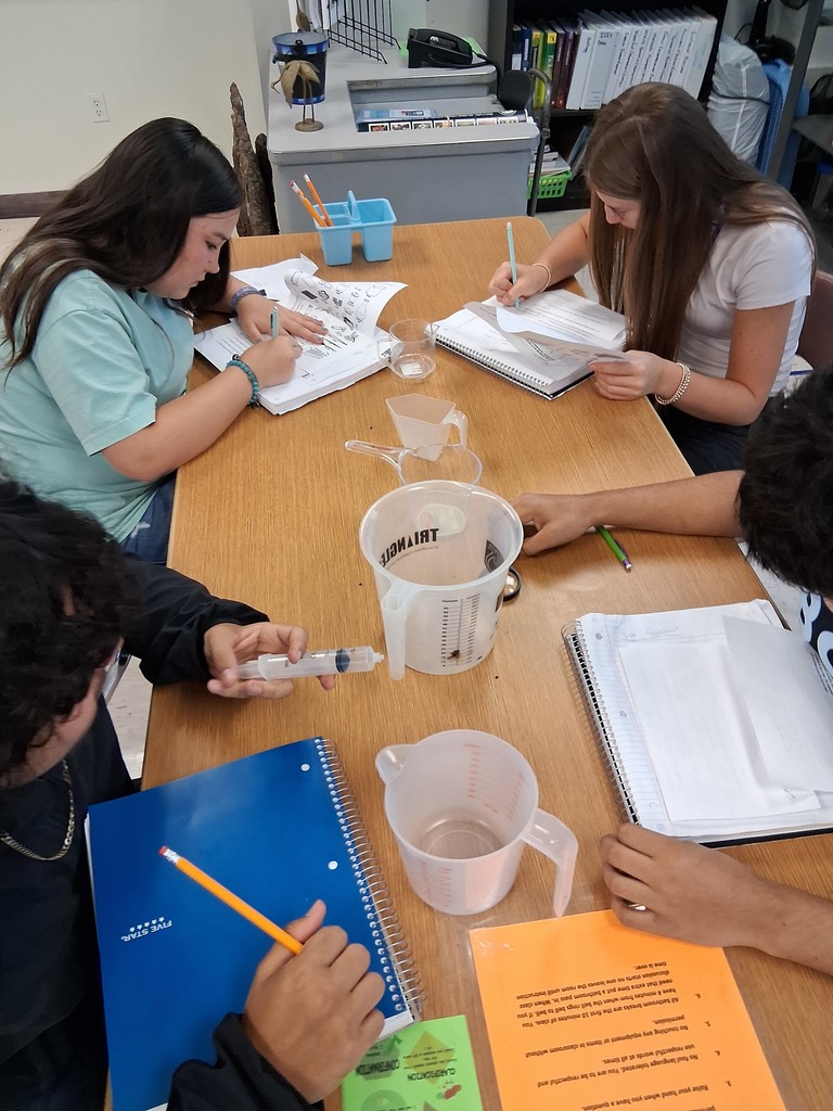 students working on lab equipment 