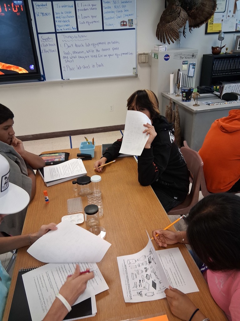 students working on lab equipment 