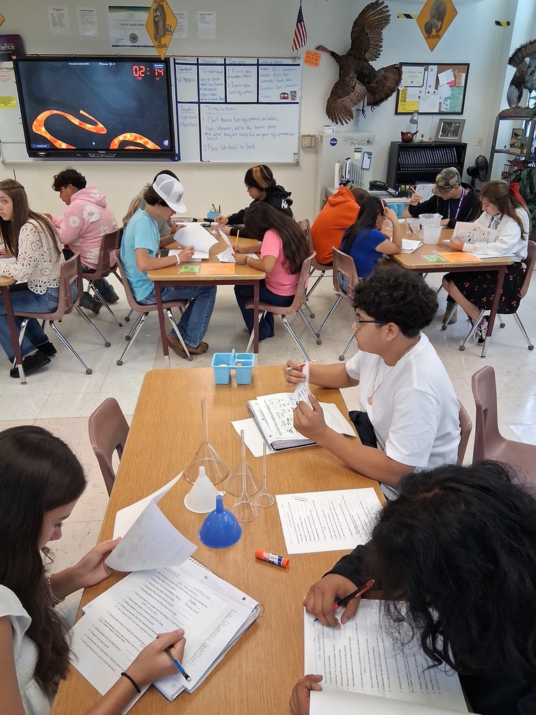 students working on lab equipment 