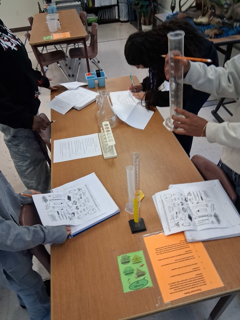 students working on lab equipment 