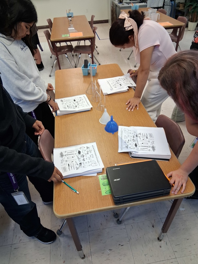 students working on lab equipment 