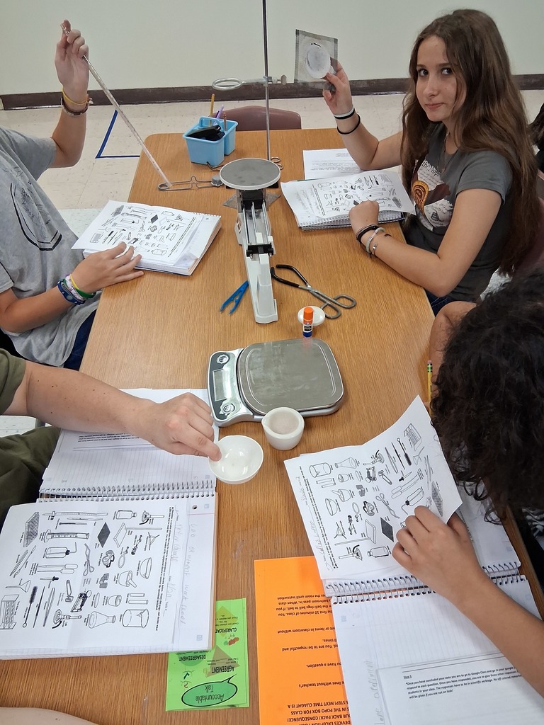 students working on lab equipment 