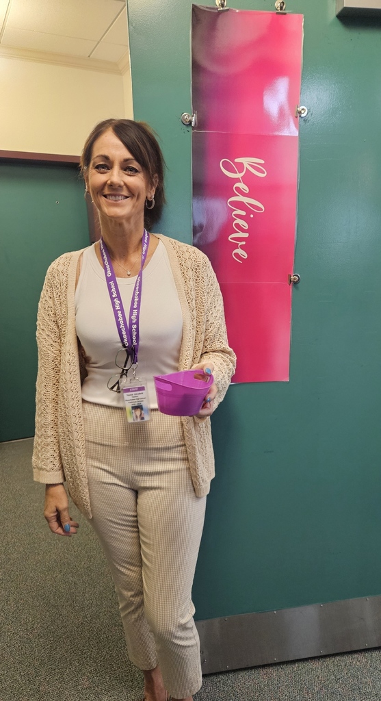 teacher standing by the door