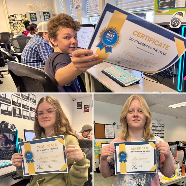 three students holding DIT certificates in class