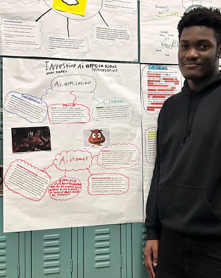 student infront of his poster 
