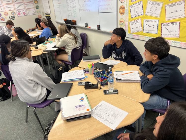 students in geometry class listening to teacher 