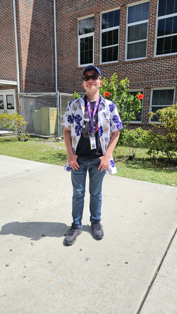 student in the courtyard wearing brahman shirt