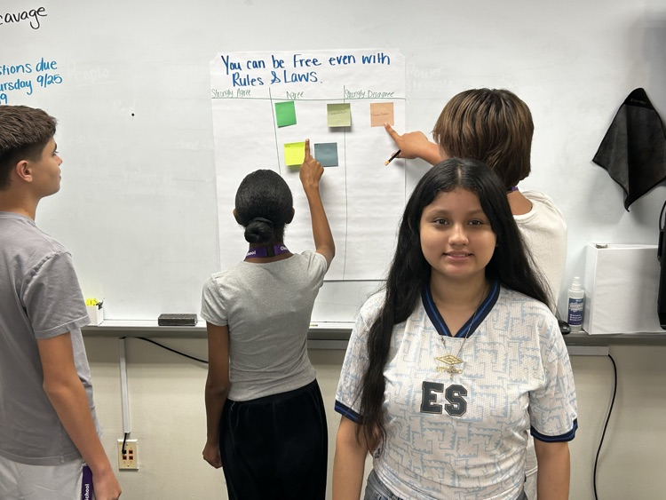 students working on poster for celebrate freedom week