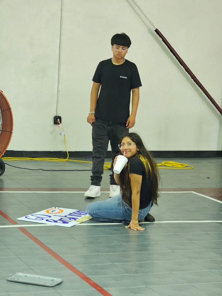 two students working on float building part 