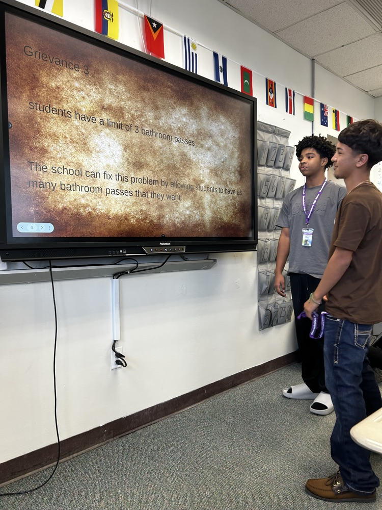 two students presenting a slideshow for celebrate freedom week