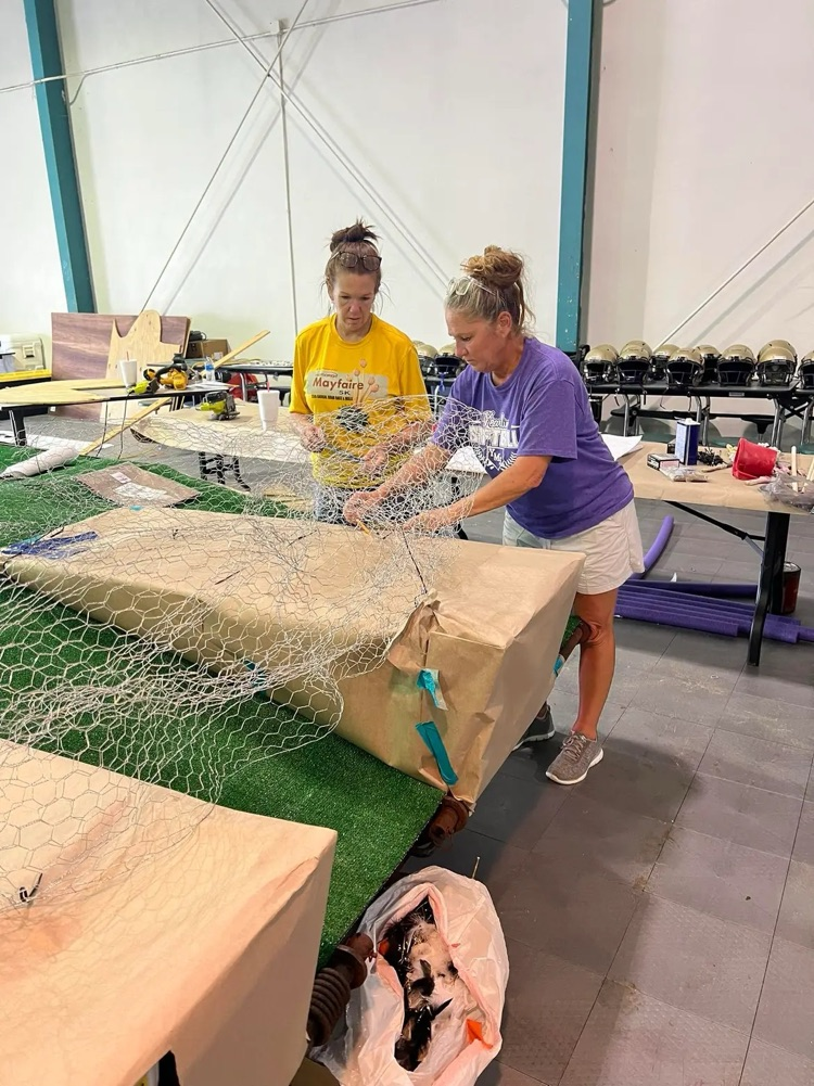 two teachers working on homecoming float