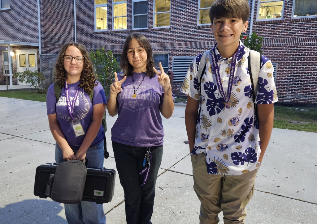 three students wearing brahman shirt for spirit week