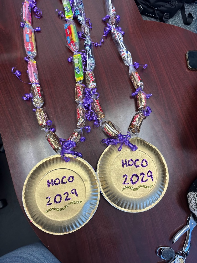 two fake gold chains made out of candy that says hoco 2029