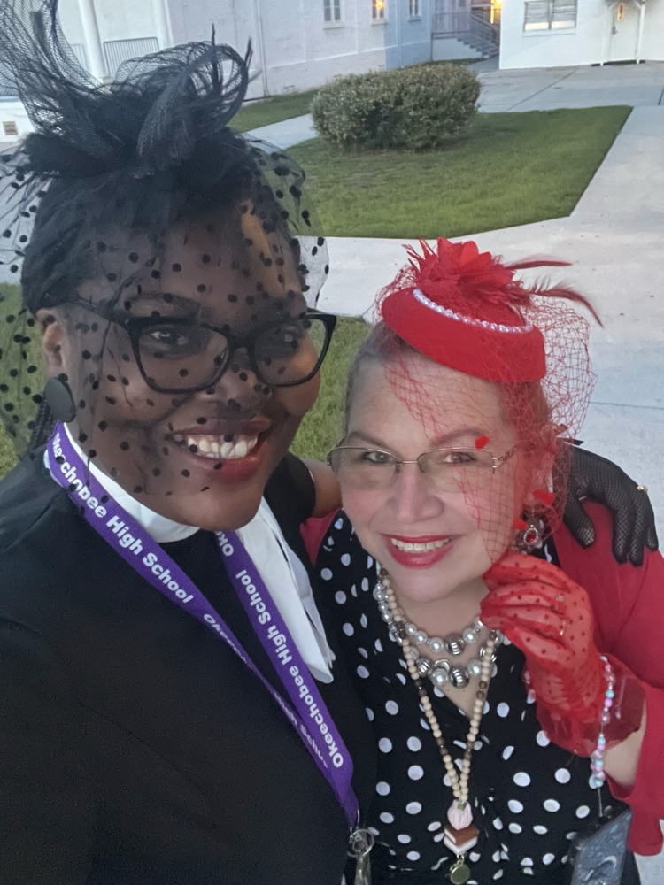 two teachers dressed in decades outfit for homecoming 