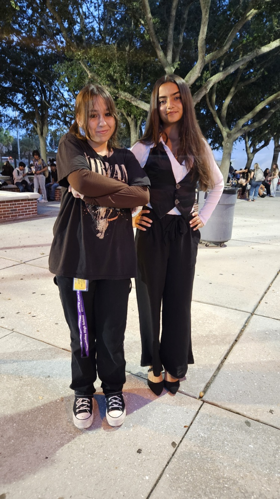 two students dressed for spirit week as parents 