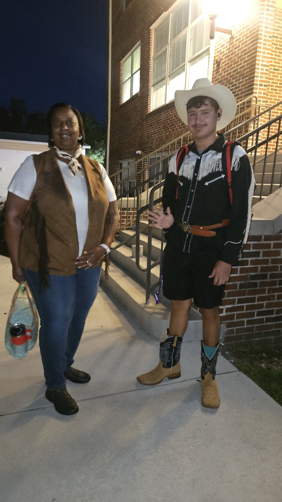 secretary and student dressed for Wild West