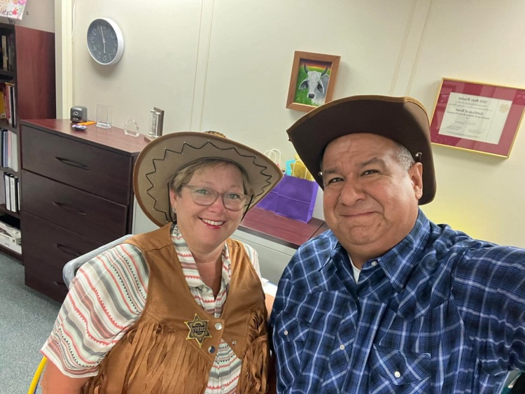 principal and teacher dressed for Wild West 