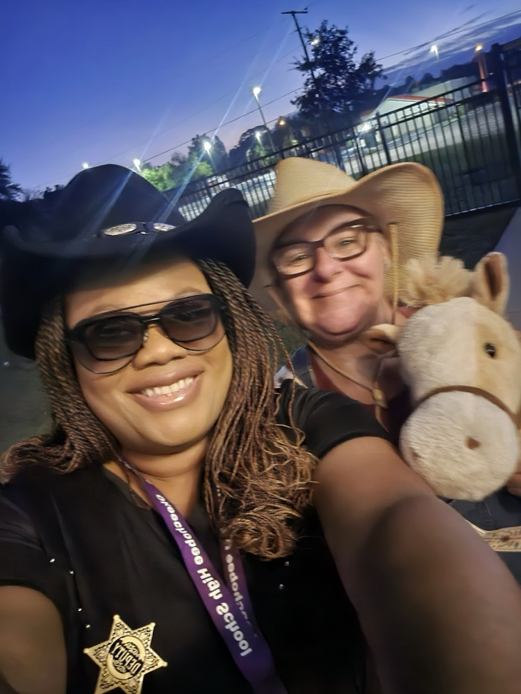 principal and teacher dressed for Wild West 