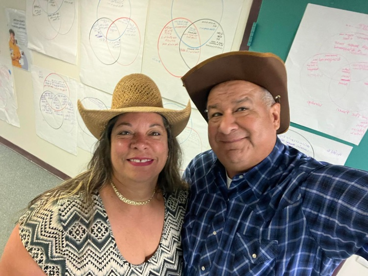 teacher and custodian dressed for Wild West 
