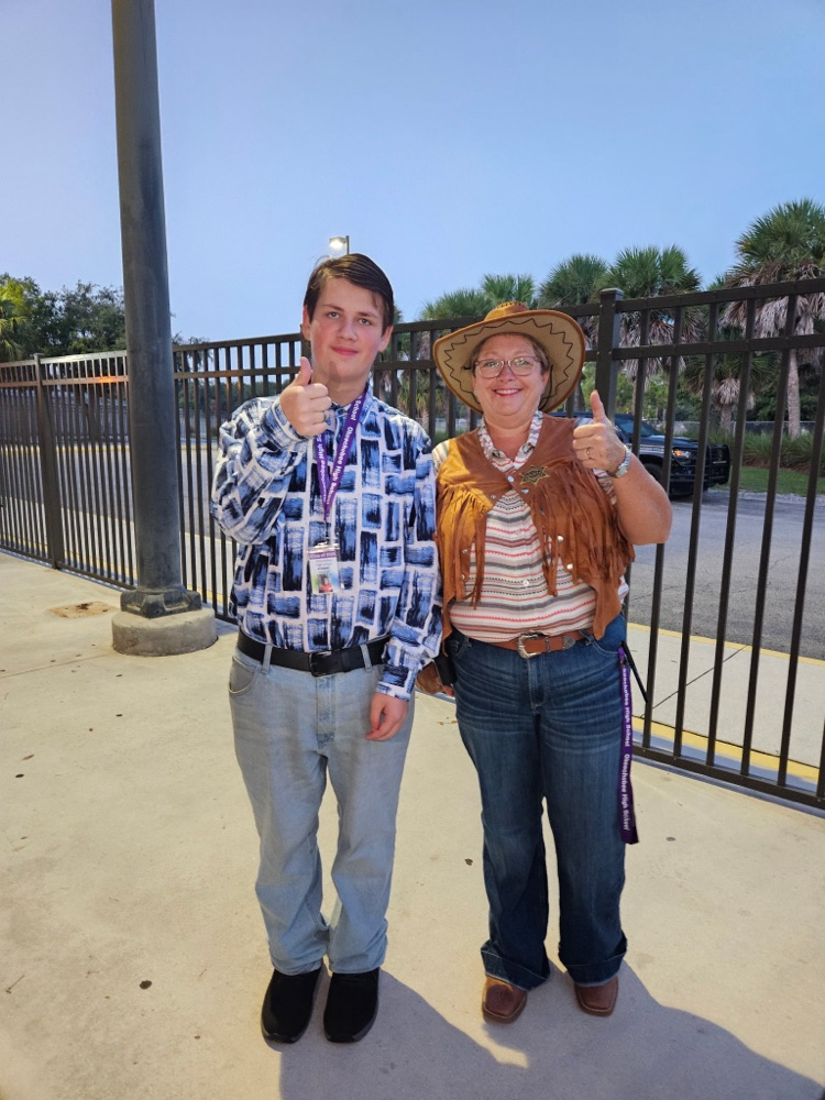 principal and student dressed for Wild West 
