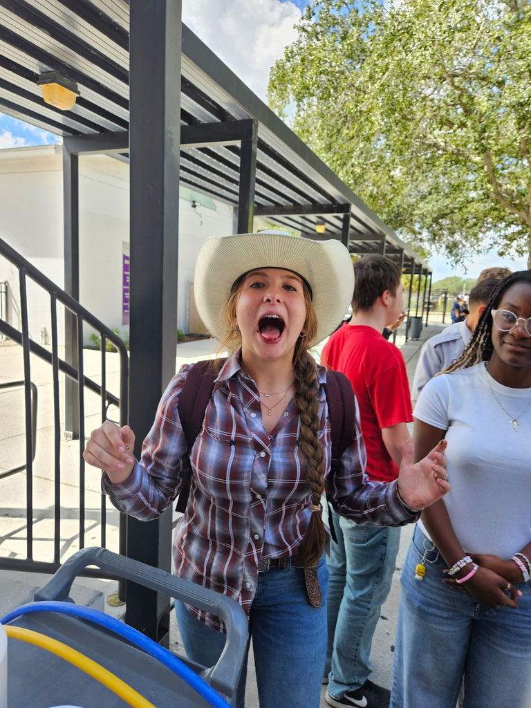 student with mouth open playing homecoming games at lunch