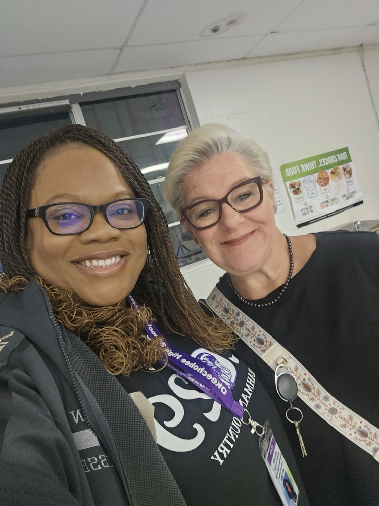 teacher and assistant principal selfie in cafetería