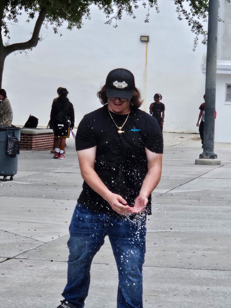 student playing water balloon game