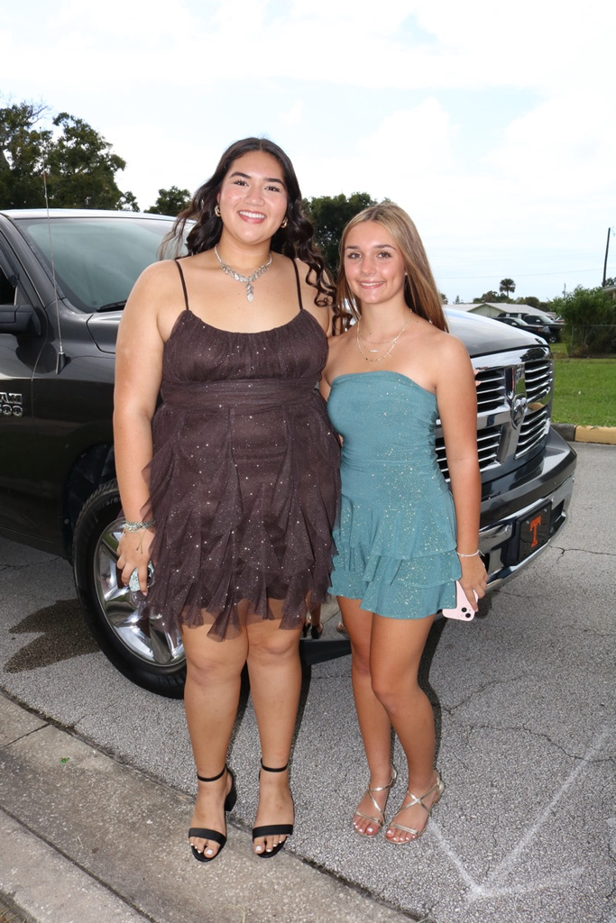 two homecoming court girls dressed for parade