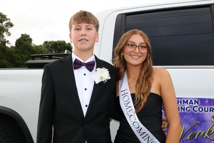 homecoming court and escort by truck for parade