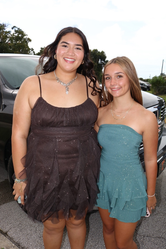 two homecoming court girls dressed for parade