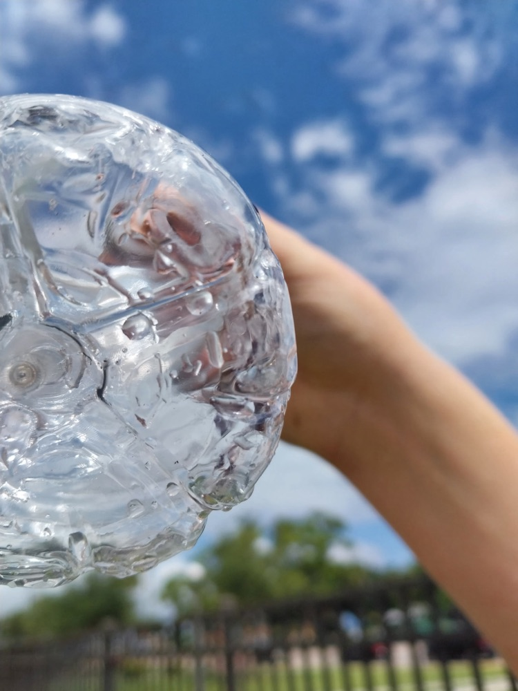 water bottle with drops of water inside 