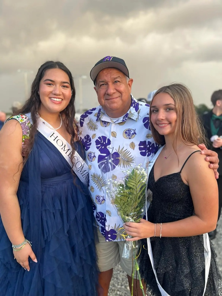 teacher with two students for homecoming court