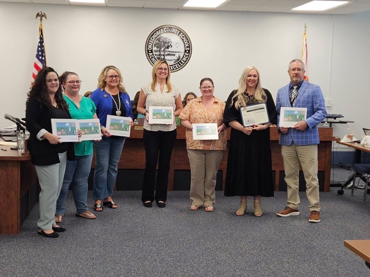 teachers with book
